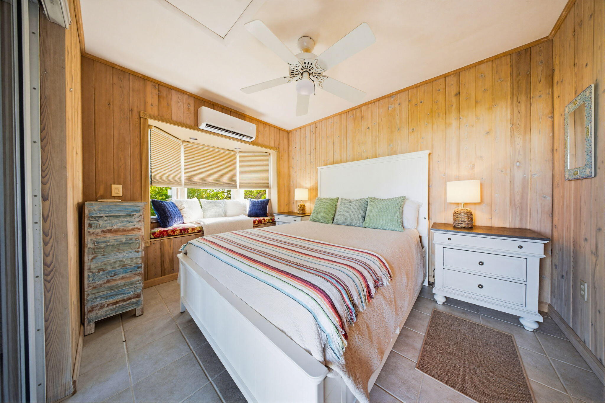 403 Indies Road Summerland Key, FL 33042 - Photo 33 of 68 a bedroom with a bed and a chandelier