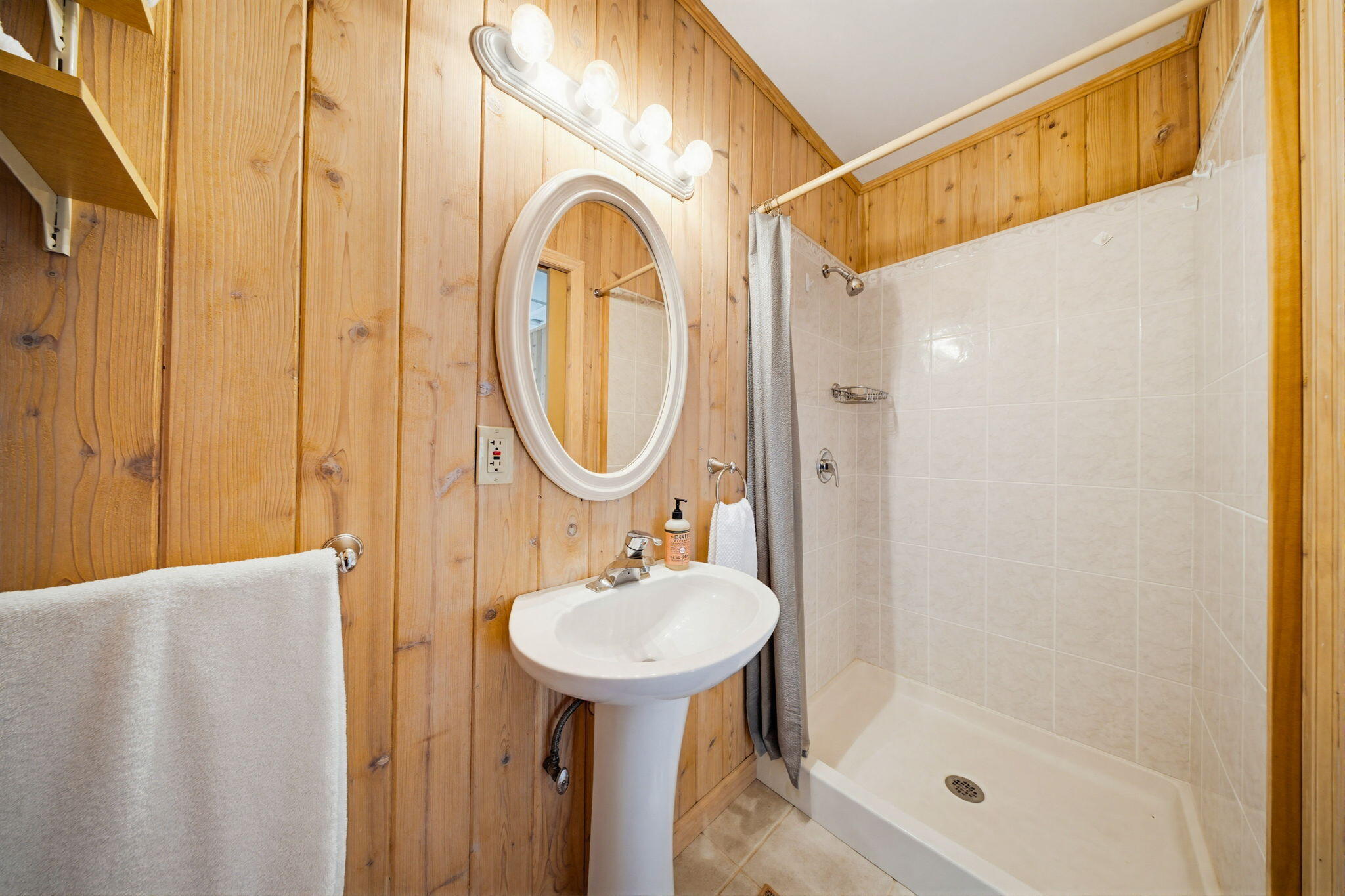 403 Indies Road Summerland Key, FL 33042 - Photo 36 of 68 a bathroom with a sink a mirror and a shower