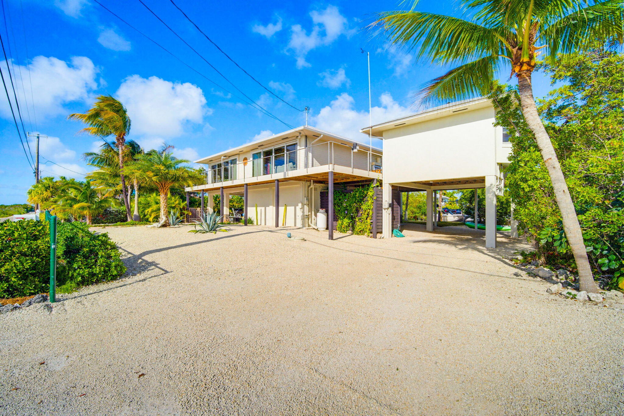 403 Indies Road Summerland Key, FL 33042 - Photo 4 of 68 a front view of a house with a yard