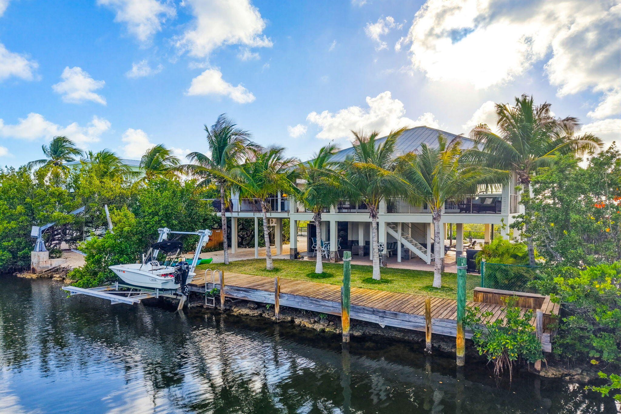403 Indies Road Summerland Key, FL 33042 - Photo 44 of 68 a view of a swimming pool with chairs