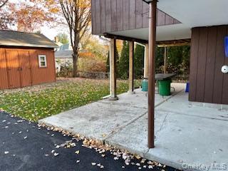 146-148 Ridge Street Pearl River, NY 10965 - Photo 2 of 19 LL (Lower Level - 2BR 1BA) Walk in entry from Driveway, backyard, patio area and storage shed