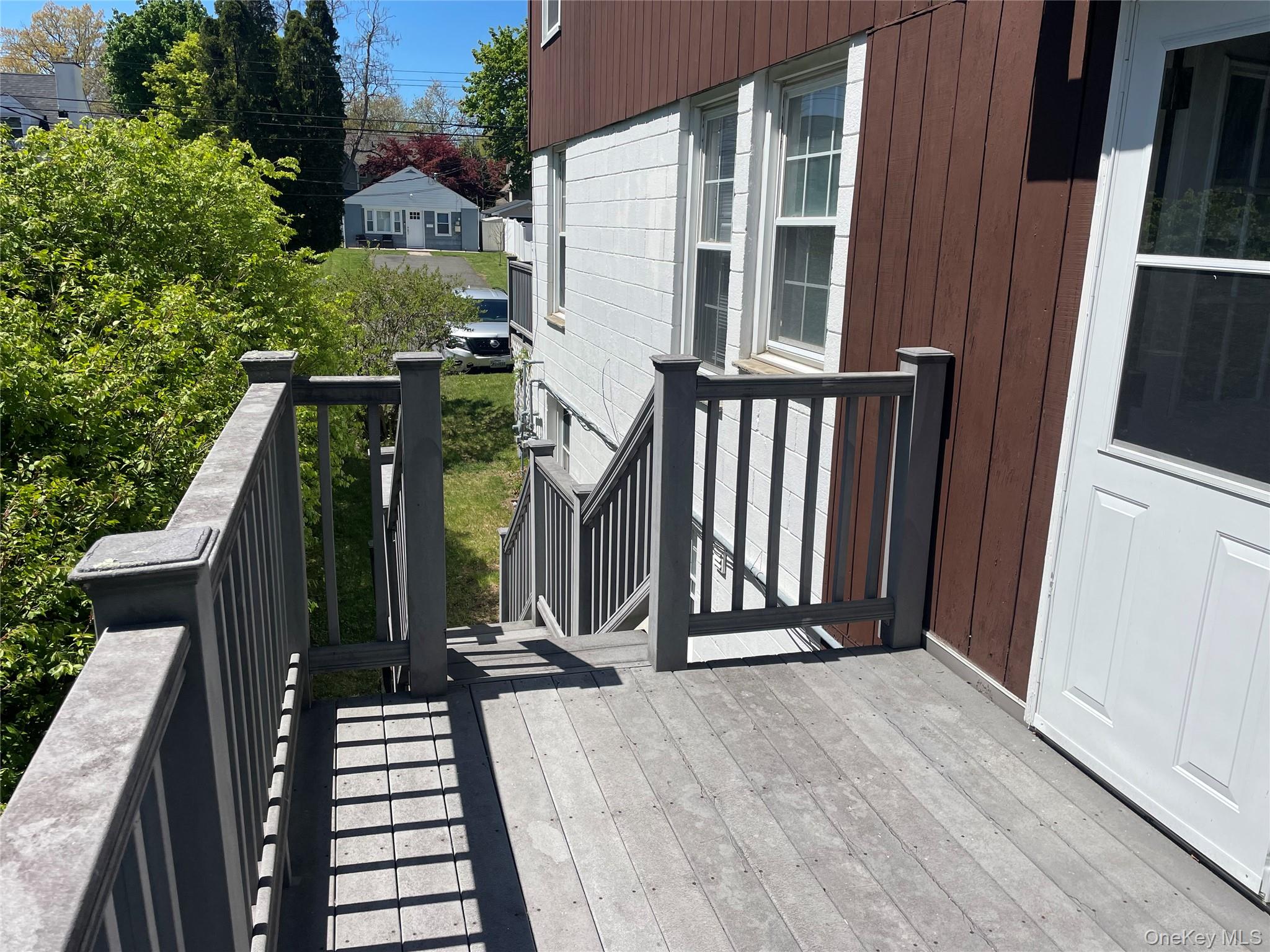 146-148 Ridge Street Pearl River, NY 10965 - Photo 3 of 19 UL (Upper Level - 3BR 1 1/2 BA) Deck, parking out front, entry street level
