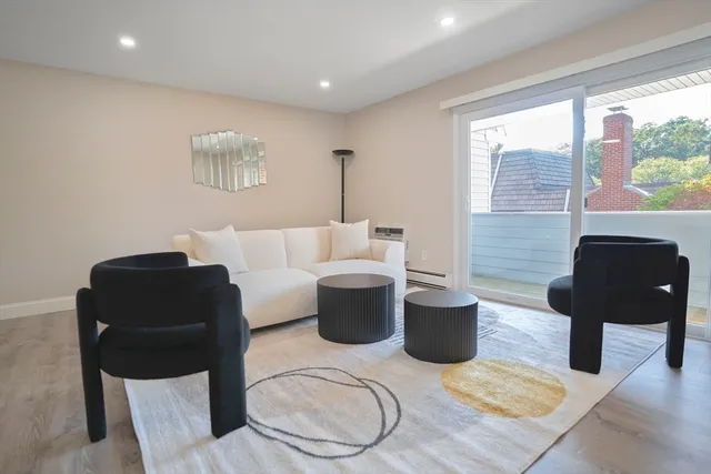 a living room with furniture and a lamp