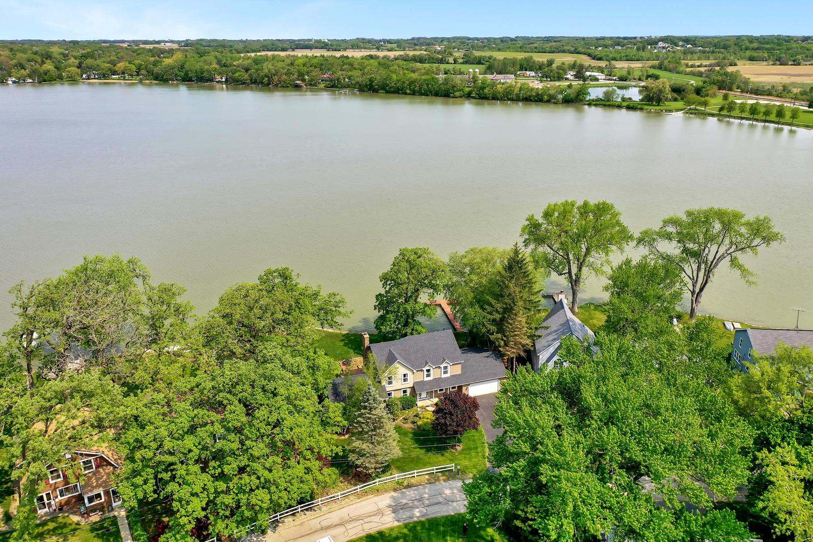 4502 West Lakewood Road McHenry, IL 60050 - Photo 2 of 3 an aerial view of a houses with lake view
