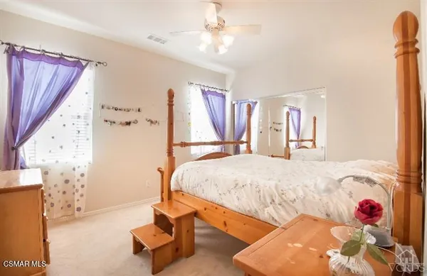 a bed room with a bed and a couch