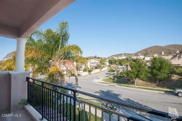 a view of a street from a balcony