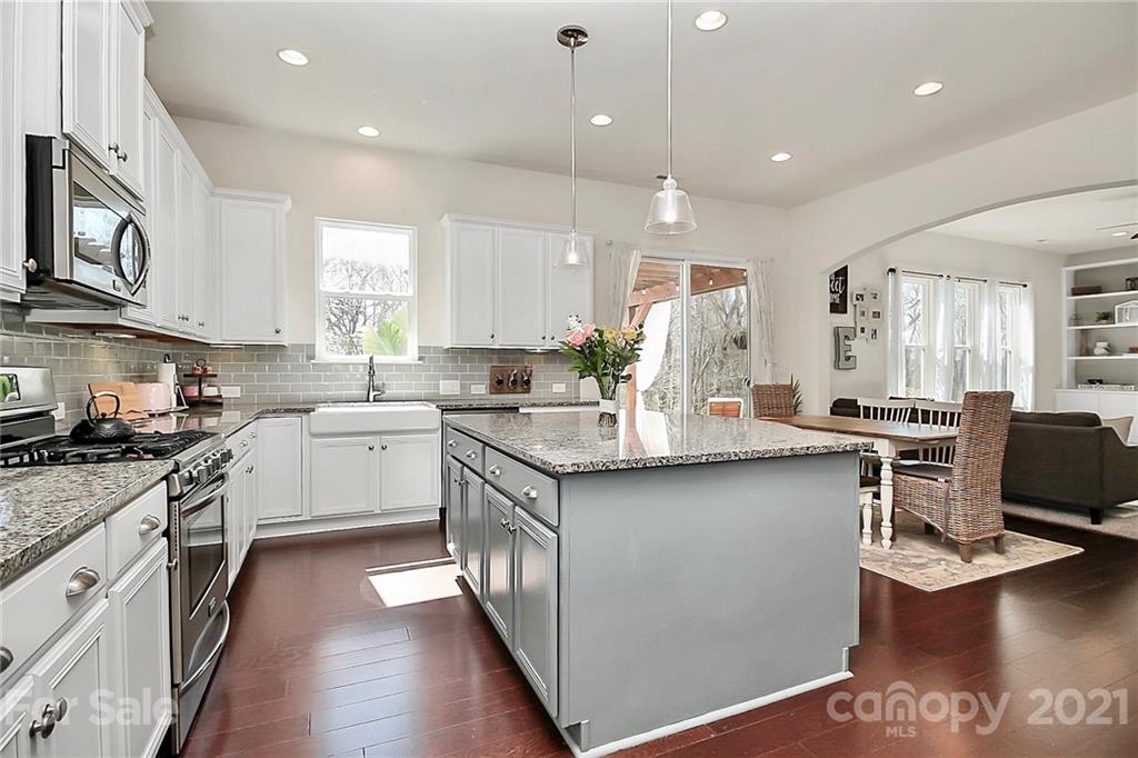 86523 Arrington Road Lancaster, SC 29720 - Photo 12 of 43 a kitchen with stainless steel appliances granite countertop a sink stove and refrigerator