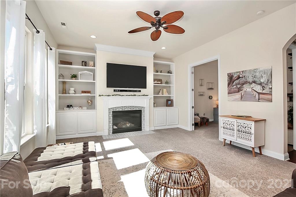 86523 Arrington Road Lancaster, SC 29720 - Photo 15 of 43 a living room with furniture a flat screen tv and a fireplace