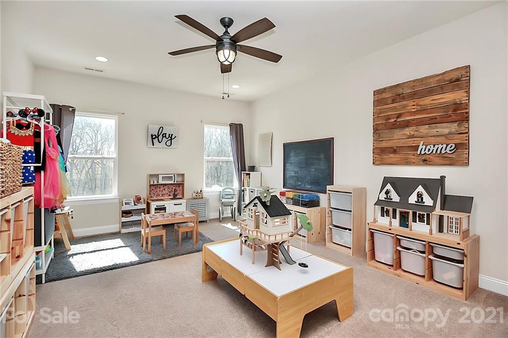 86523 Arrington Road Lancaster, SC 29720 - Photo 22 of 43 a living room with furniture and a flat screen tv