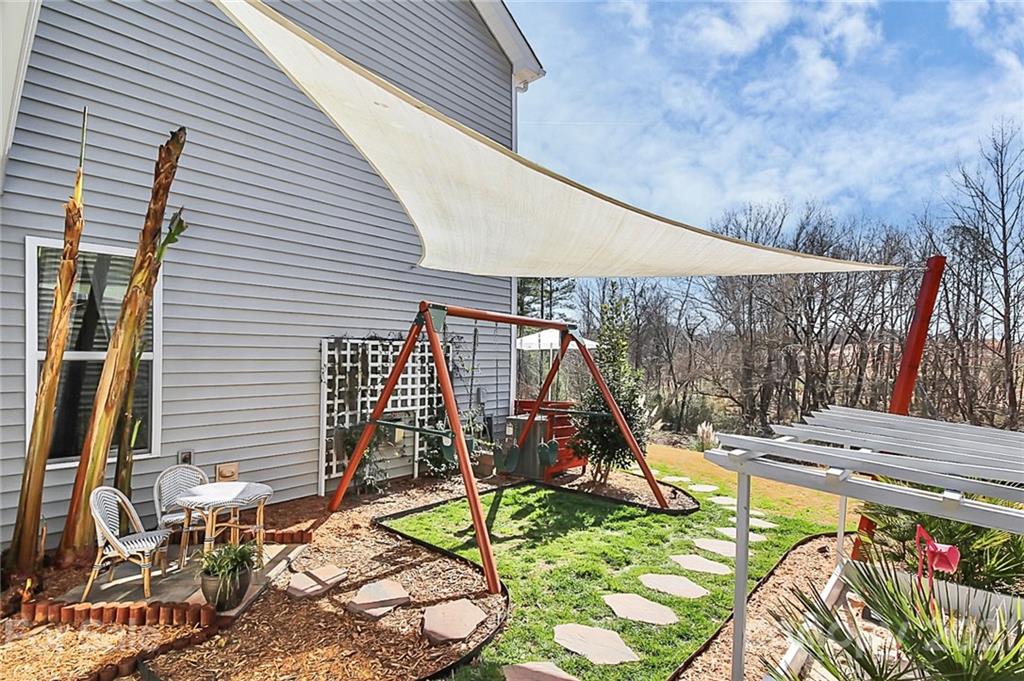 86523 Arrington Road Lancaster, SC 29720 - Photo 4 of 43 a view of a patio with a table and chairs