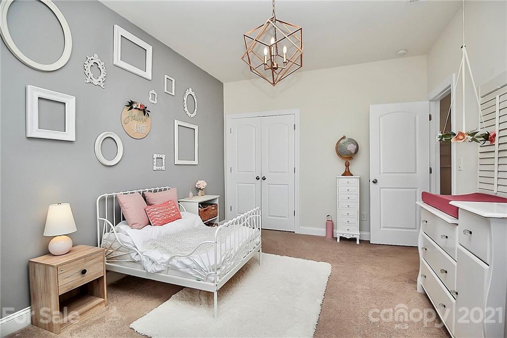 86523 Arrington Road Lancaster, SC 29720 - Photo 31 of 43 a bedroom with a bed and cabinets