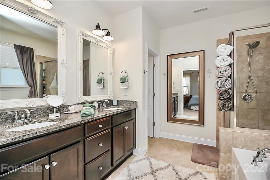 86523 Arrington Road Lancaster, SC 29720 - Photo 35 of 43 a bathroom with a granite countertop sink mirror and a