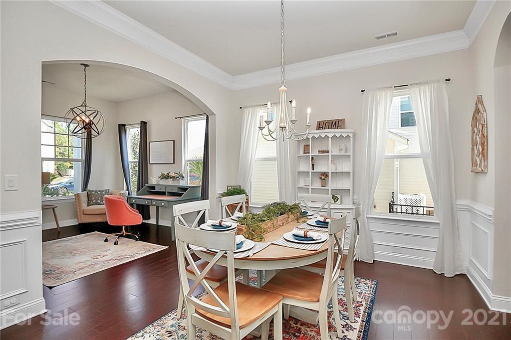 86523 Arrington Road Lancaster, SC 29720 - Photo 7 of 43 a dining room with furniture a chandelier and wooden floor
