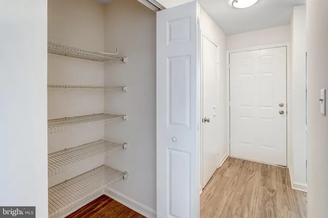 a view of a room with wooden floor