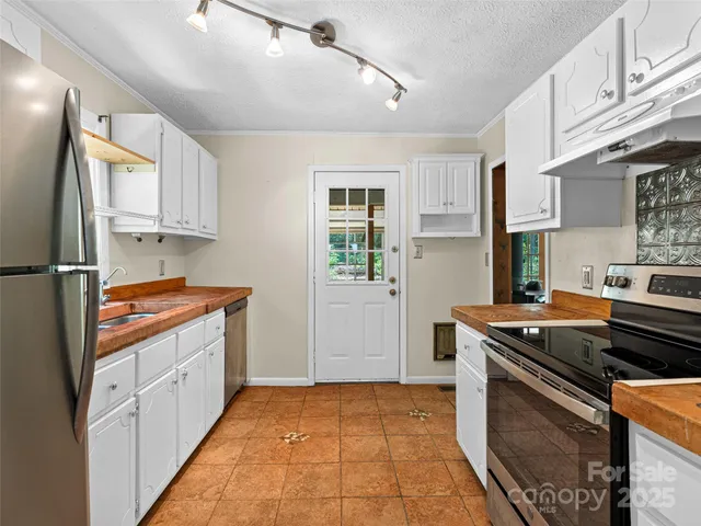 a white bath tub sitting next to a shower
