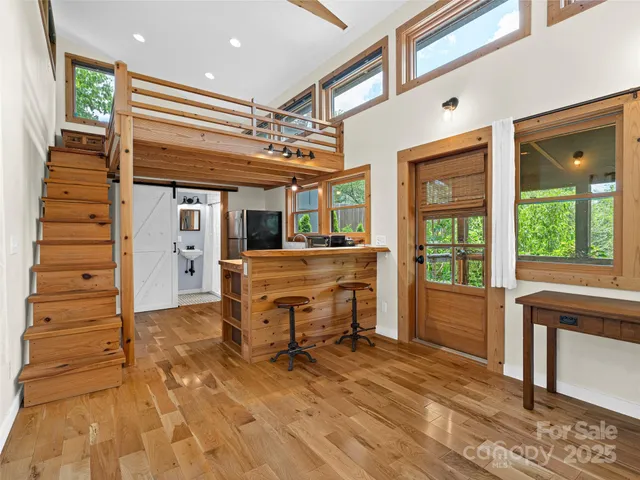 a view of a kitchen with a sink and windows