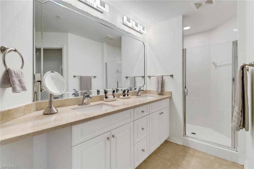 450 Bayfront Place, Unit 4206 Naples, FL 34102 - Photo 14 of 27 a bathroom with double sink and a mirror
