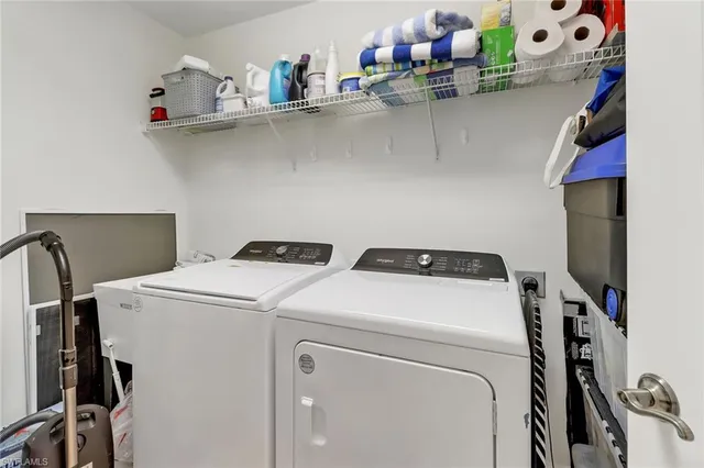a utility room with dryer and washer