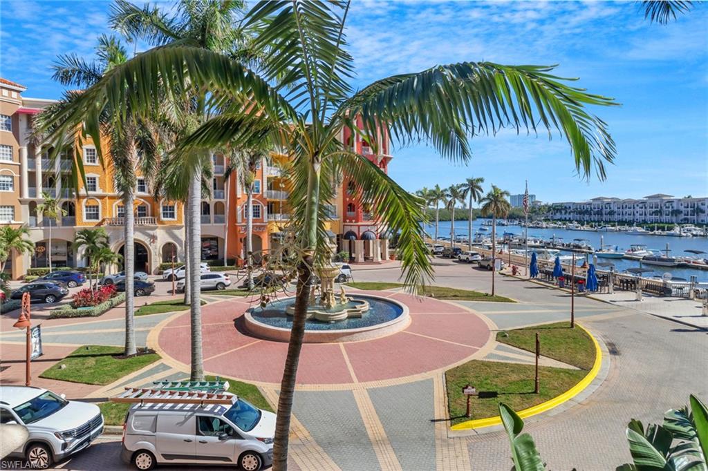 450 Bayfront Place, Unit 4206 Naples, FL 34102 - Photo 19 of 27 a swimming pool with outdoor seating and yard
