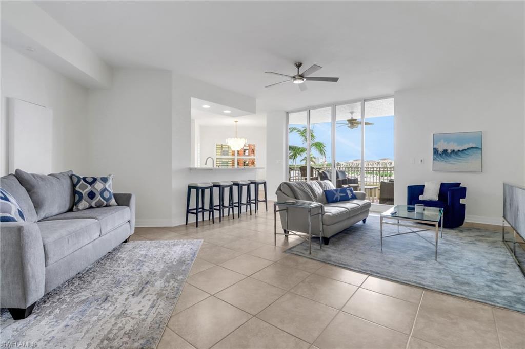 450 Bayfront Place, Unit 4206 Naples, FL 34102 - Photo 2 of 27 a living room with furniture and a large window