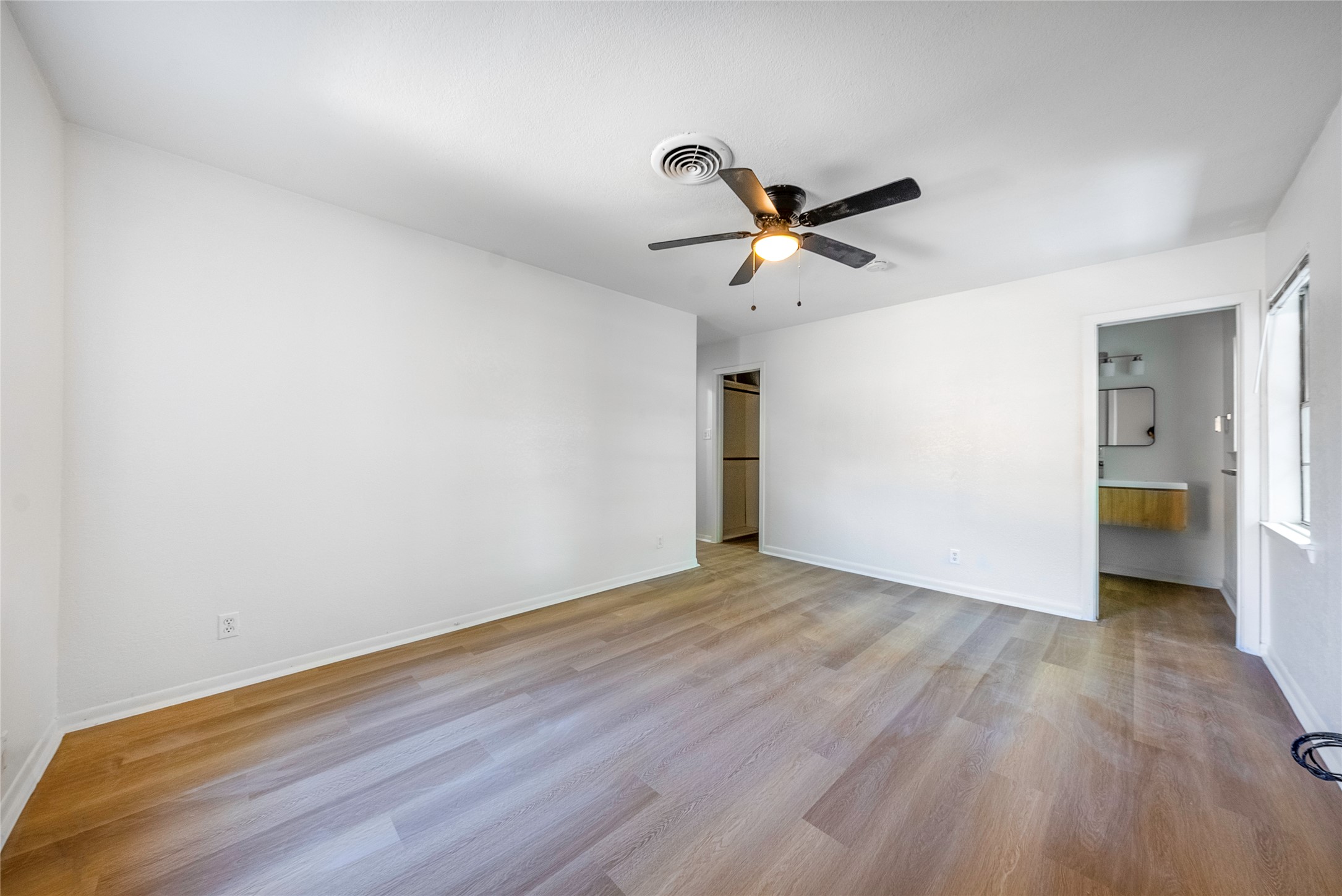 807 Country Club Road Georgetown, TX 78628 - Photo 15 of 28 a view of empty room with wooden floor