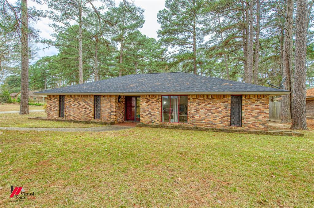 1404 North Acres Circle Springhill, LA 71075 - Photo 3 of 29 Ranch-style house with a front lawn, brick siding, and roof with shingles