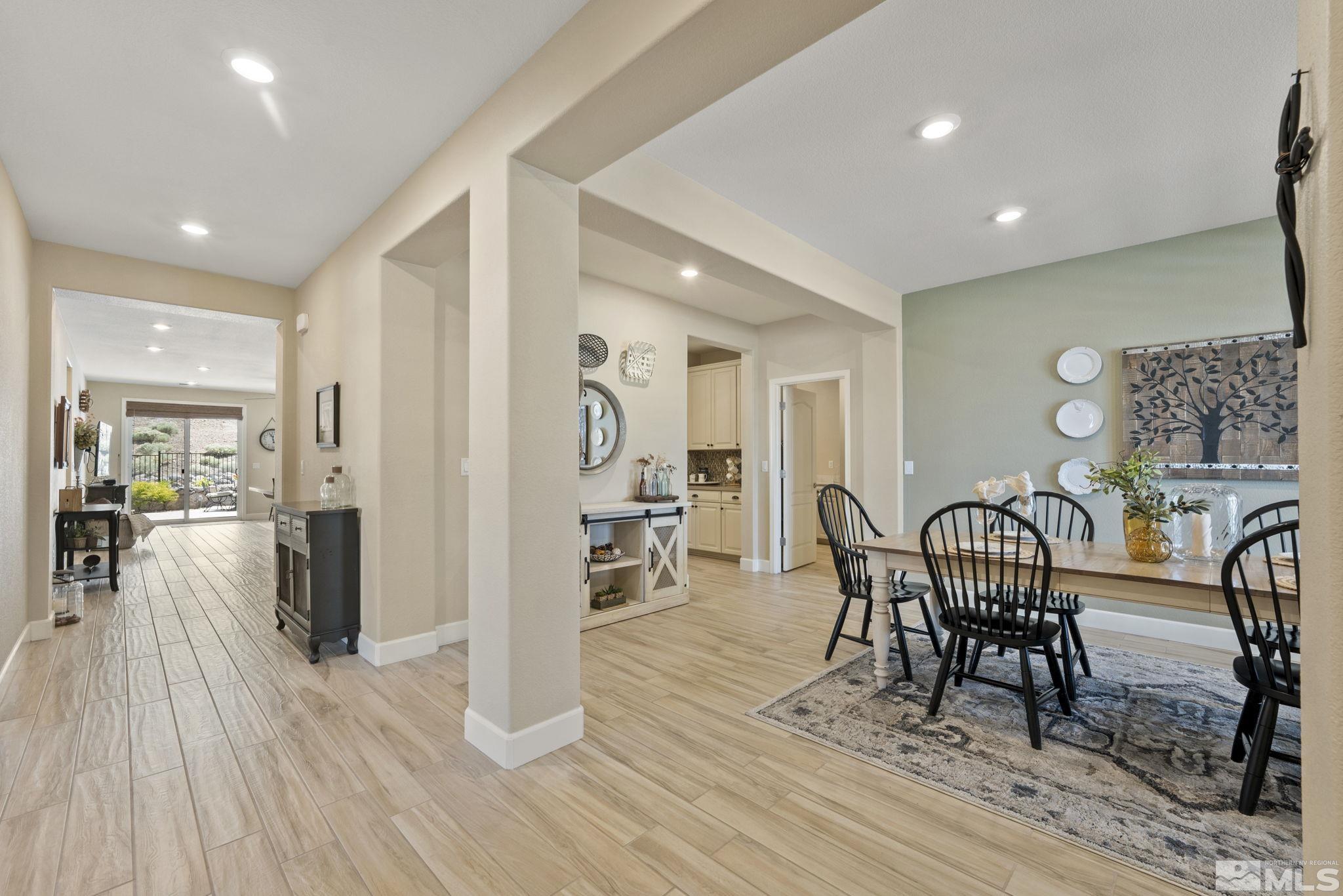 10416 Palladium Mine Drive Reno, NV 89521 - Photo 4 of 40 a view of a dining room with furniture and wooden floor