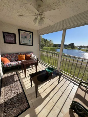 a kitchen with cabinets and chairs