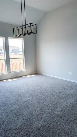 a view of room with window and stairs