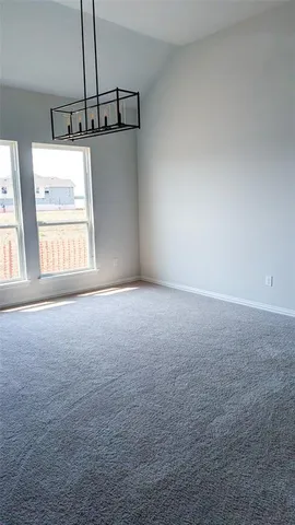 a view of room with window and stairs