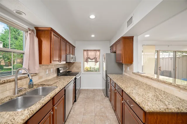 a view of cabinets and wooden floor