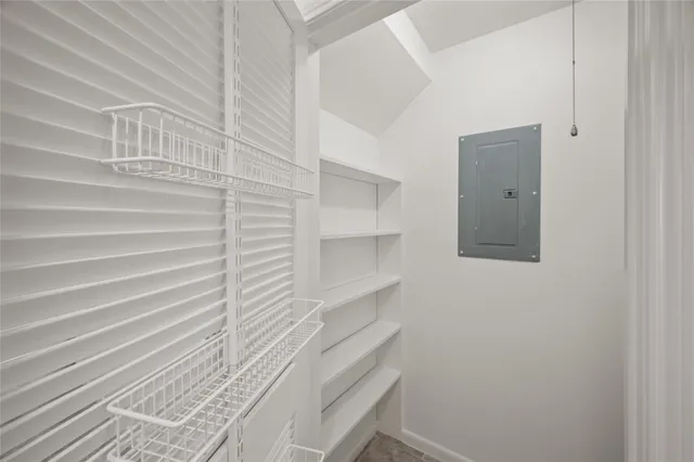 a living room with stainless steel appliances granite countertop furniture and a fireplace