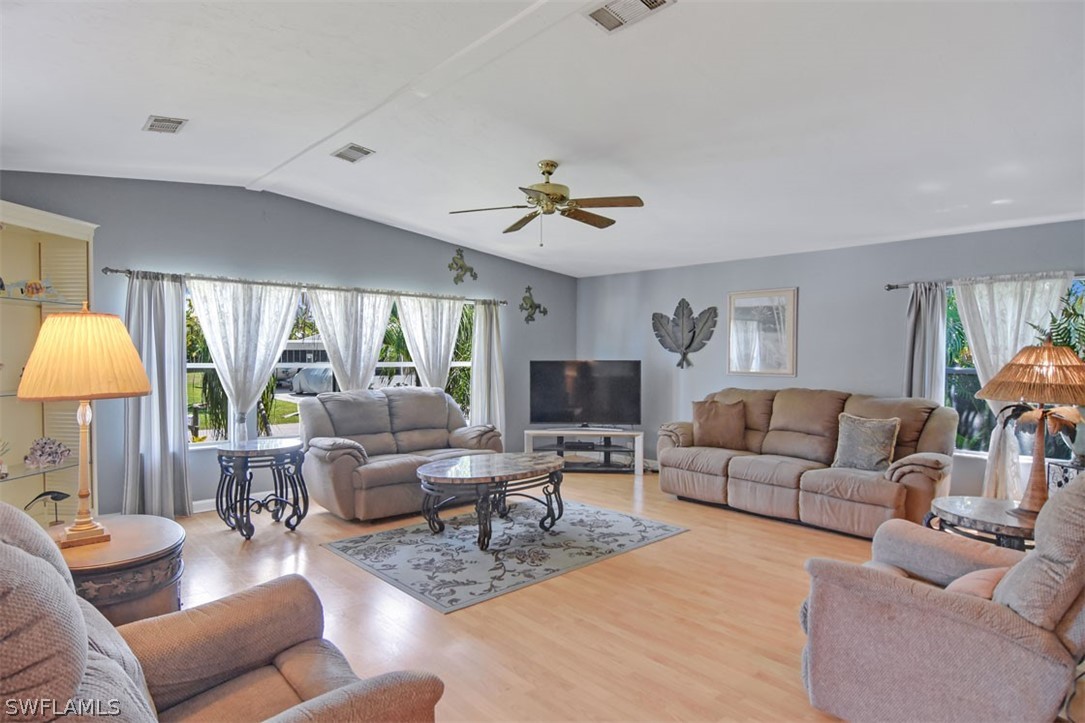 7695 Farrell Road Bokeelia, FL 33922 - Photo 8 of 28 a living room with furniture and a large window
