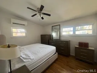 a bedroom with a bed and a desk