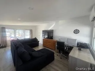 a living room with furniture and a window