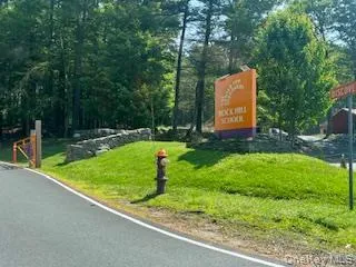 a flag is sitting in the middle of a park
