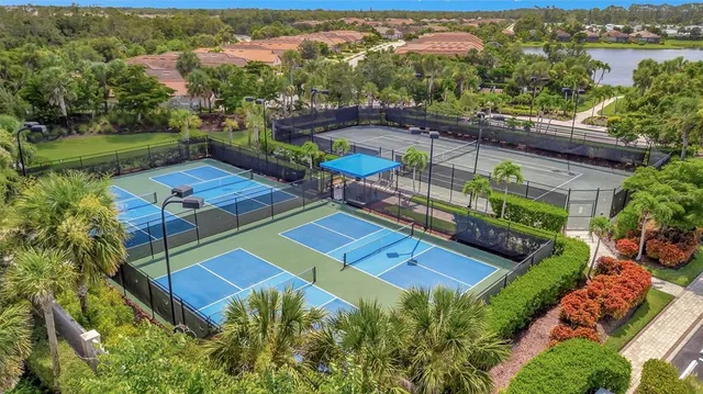 a living room with furniture wooden floor and a flat screen tv
