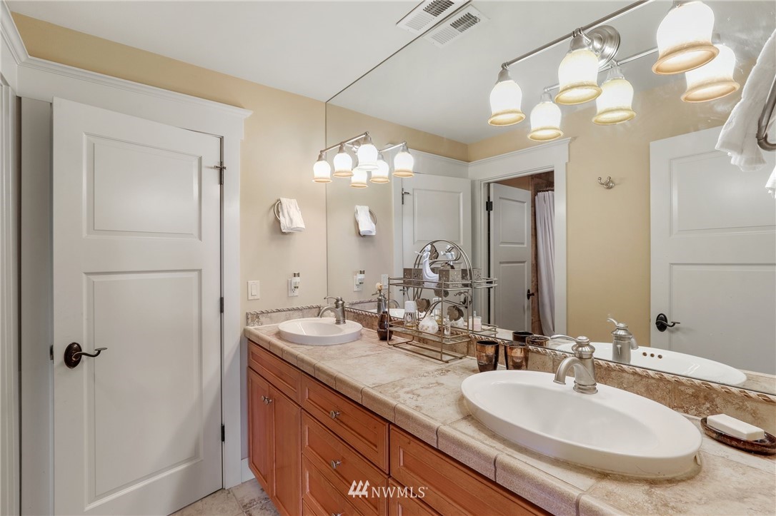 1000 North 37th Street Renton, WA 98056 - Photo 22 of 36 a bathroom with a double vanity sink and a mirror