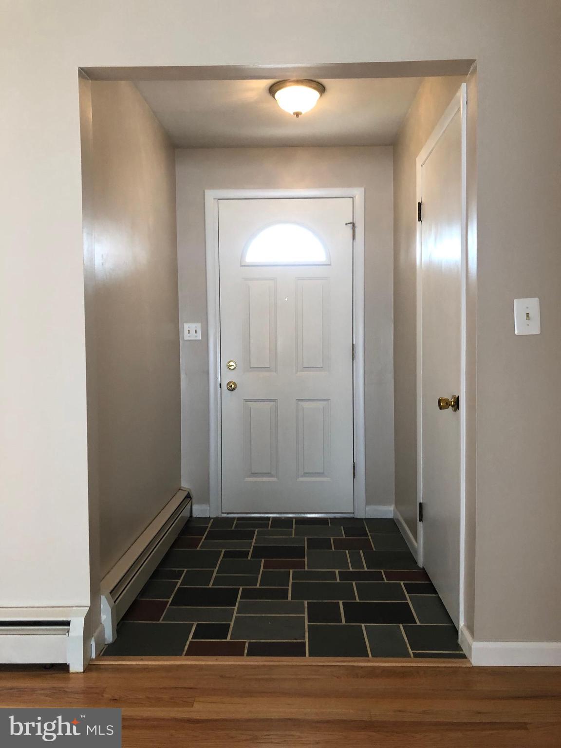 8459 Geneva Road Pasadena, MD 21122 - Photo 3 of 16 entrance foyer