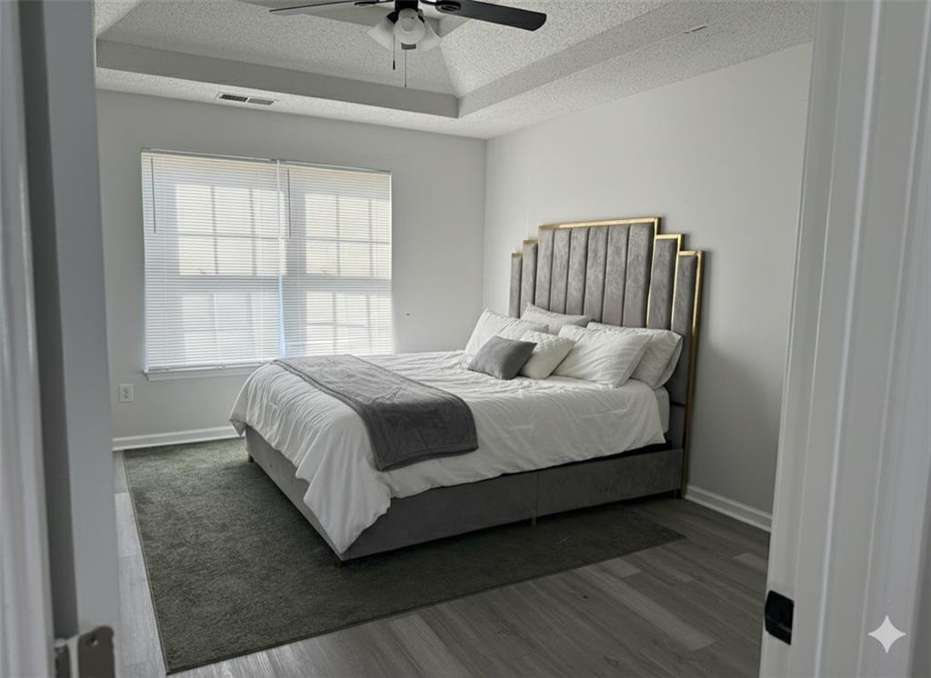 8258 Champion Trail Fairburn, GA 30213 - Photo 6 of 7 a bedroom with a bed and window