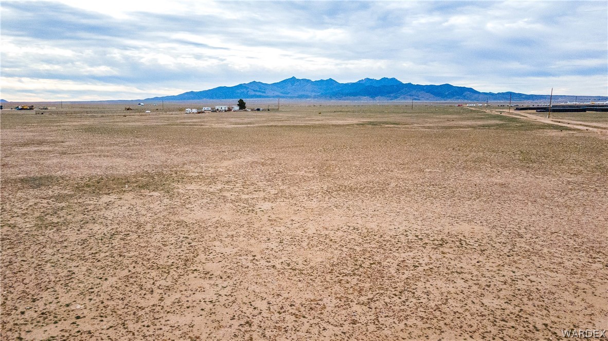 0 East Parker Road, Unit 119 Kingman, AZ 86401 - Photo 15 of 16 Expansive undeveloped land featuring a distant mountain range and a wide-open landscape