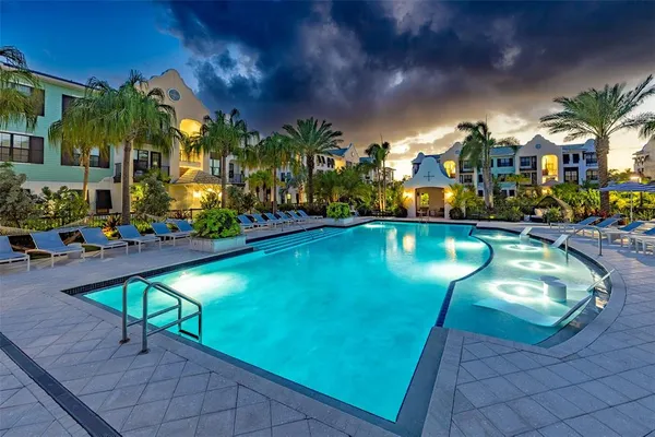 a swimming pool with outdoor seating and yard