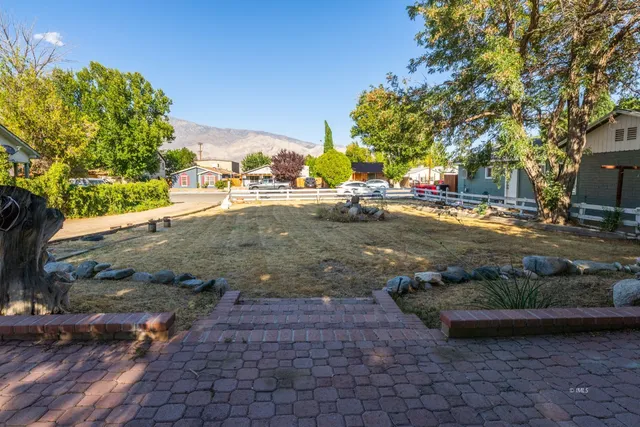 a view of a street with houses on the side