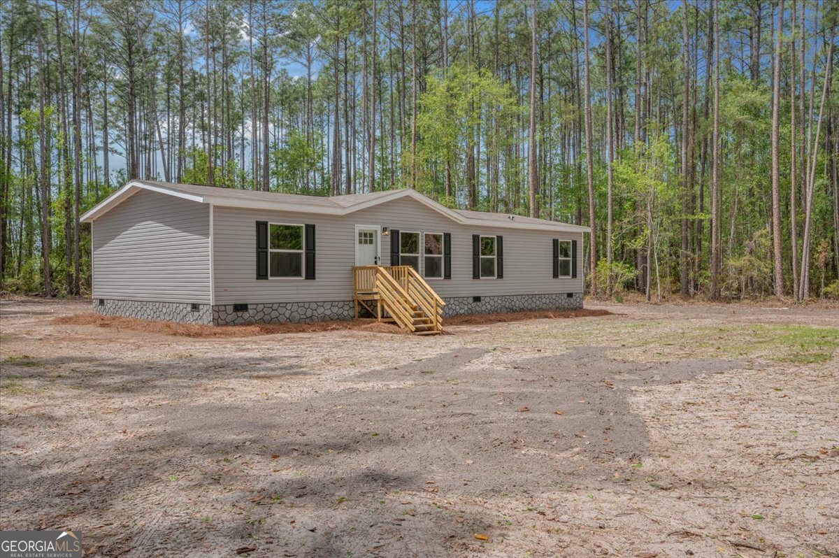 29 Clyde Road White Oak, GA 31568 - Photo 2 of 46 front view of a house with a yard