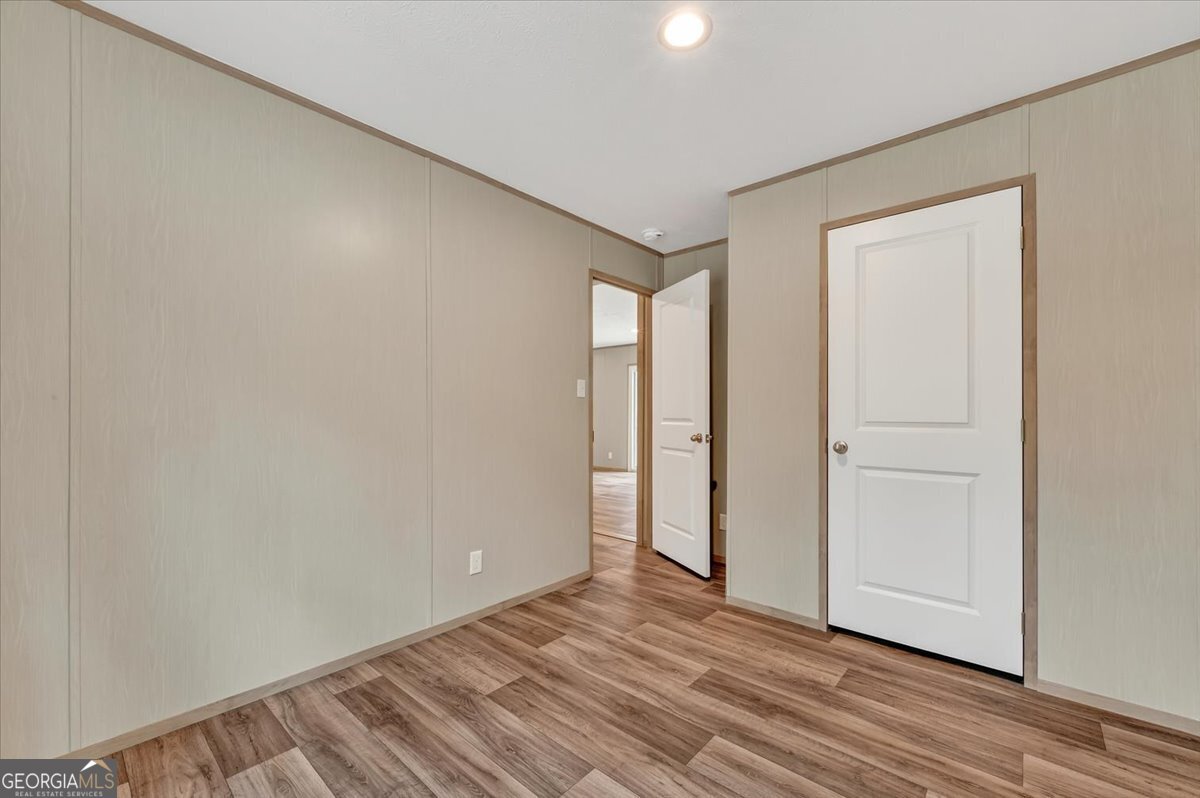 29 Clyde Road White Oak, GA 31568 - Photo 27 of 46 a view of an empty room and wooden floor