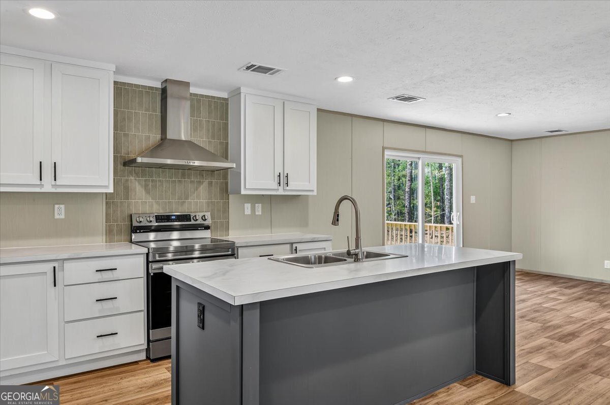 29 Clyde Road White Oak, GA 31568 - Photo 29 of 46 a kitchen with stainless steel appliances granite countertop a sink stove and cabinets