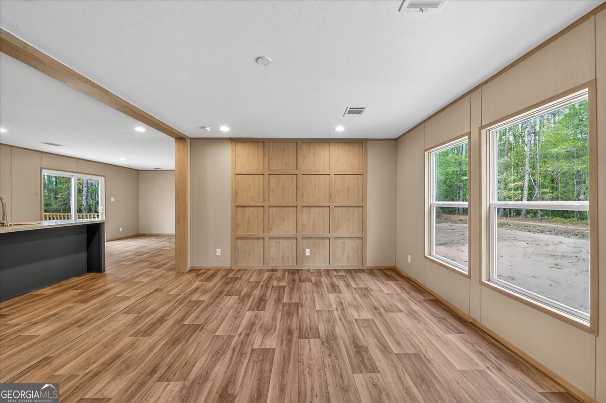 29 Clyde Road White Oak, GA 31568 - Photo 36 of 46 a view of empty room with wooden floor and fan