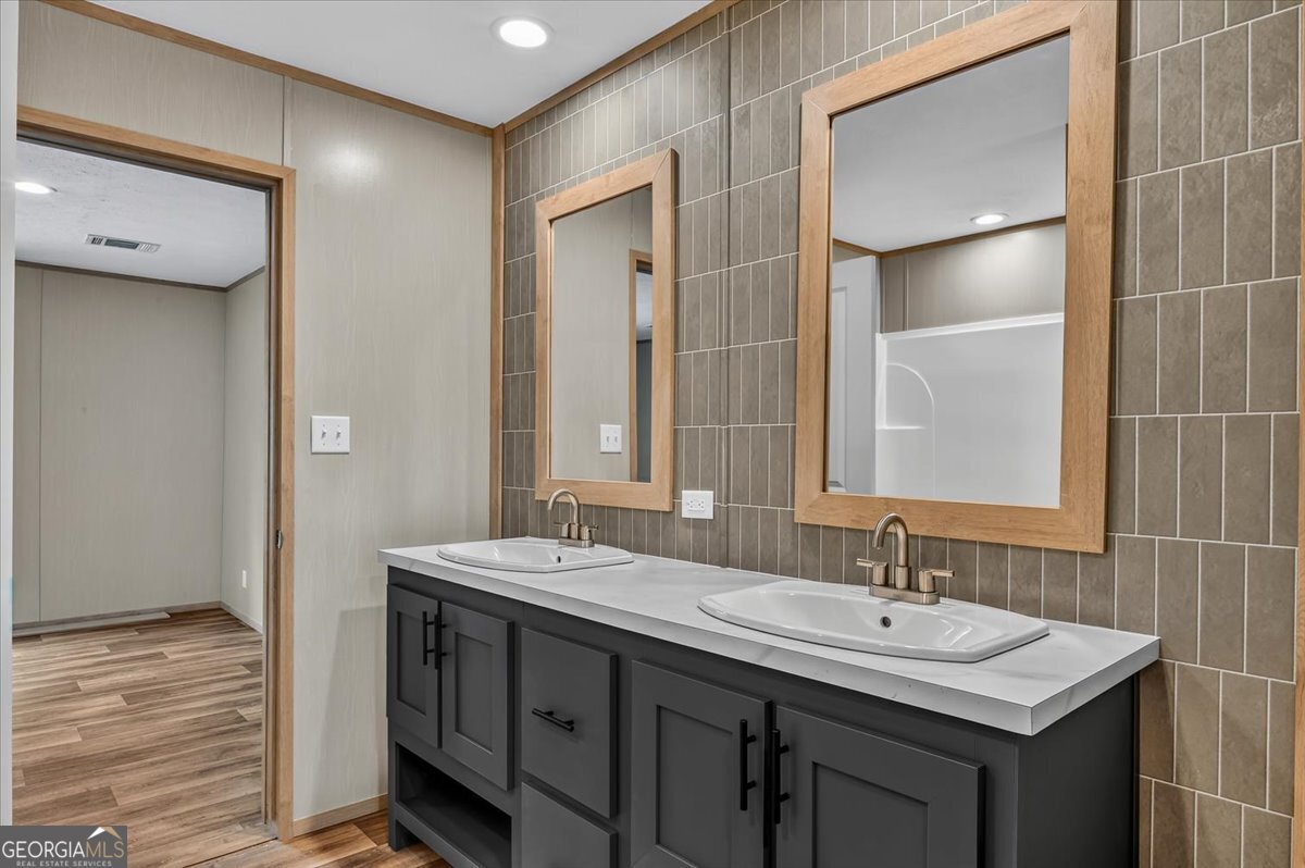 29 Clyde Road White Oak, GA 31568 - Photo 37 of 46 a bathroom with a double vanity sink mirror and