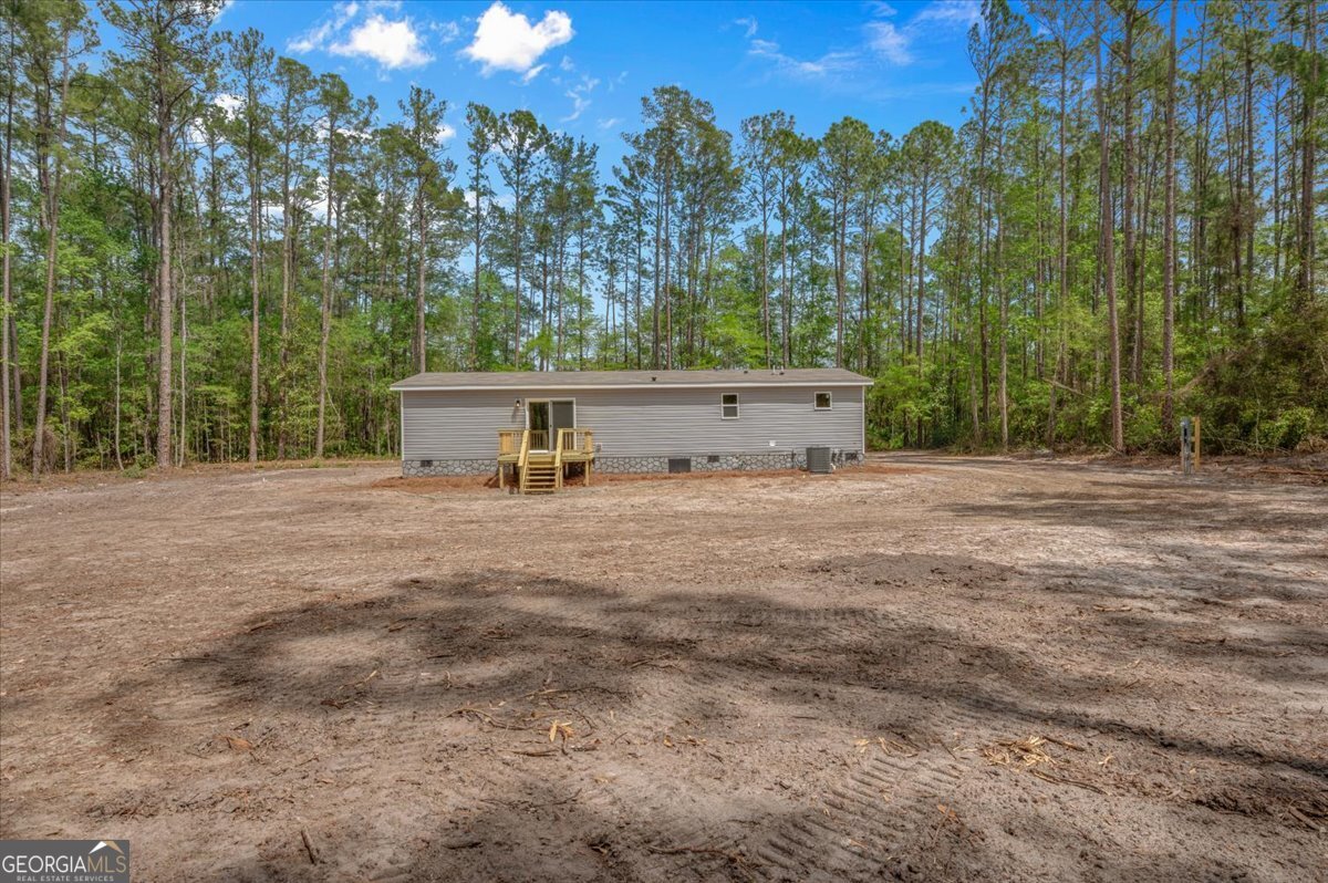 29 Clyde Road White Oak, GA 31568 - Photo 45 of 46 a view of a house with a yard and tree s