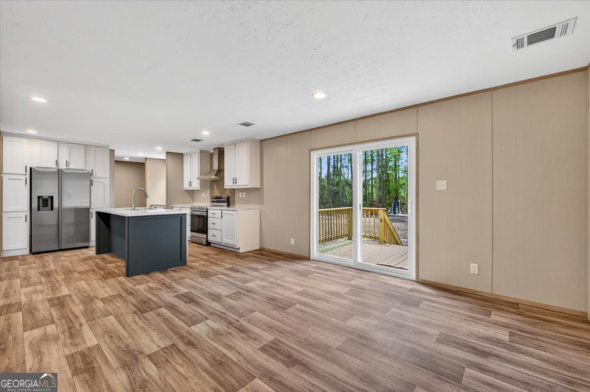 29 Clyde Road White Oak, GA 31568 - Photo 7 of 46 a view of kitchen with wooden floor